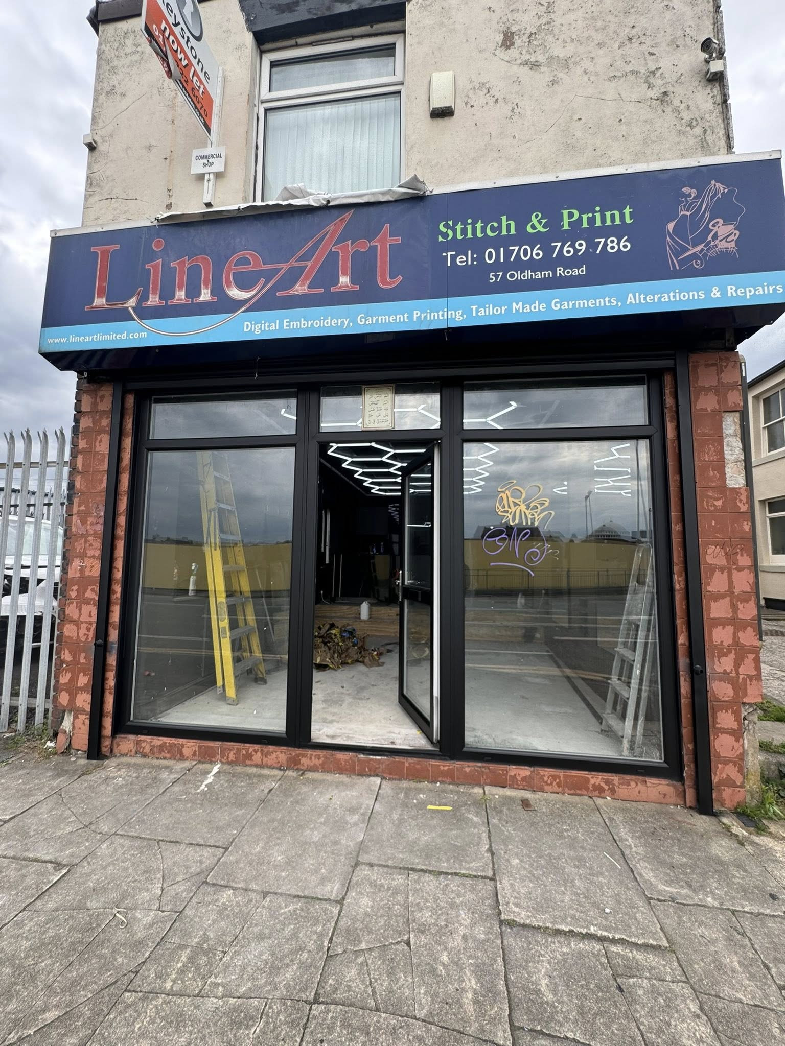 After: shopfront UPVC sprayed to brand colour
