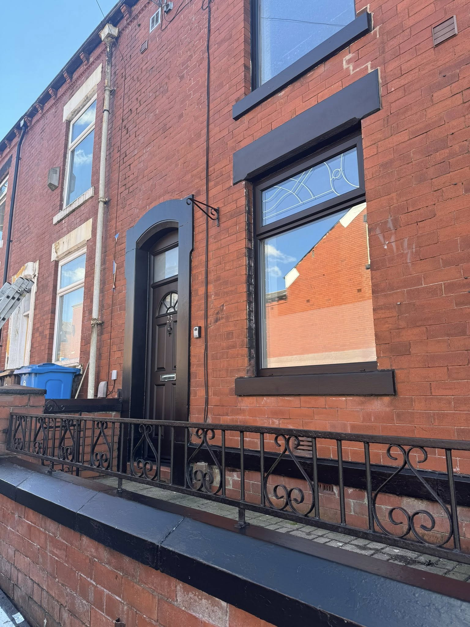 After: UPVC windows sprayed dark green